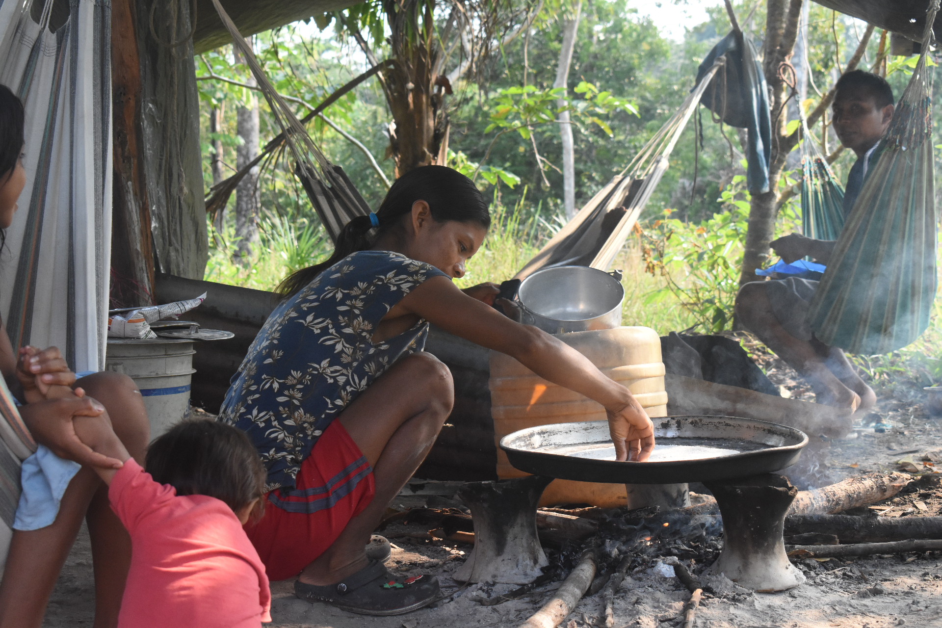 Camp life in the Darién — cooking by the fire under hammocks